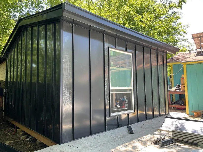 Black standing seam metal wall panels for Roof Inspection in Cold Spring