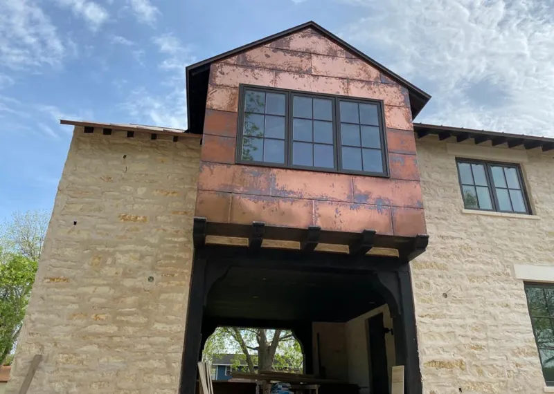 Copper metal panel facade on a stone building for Skylight Installation in Cold Spring
